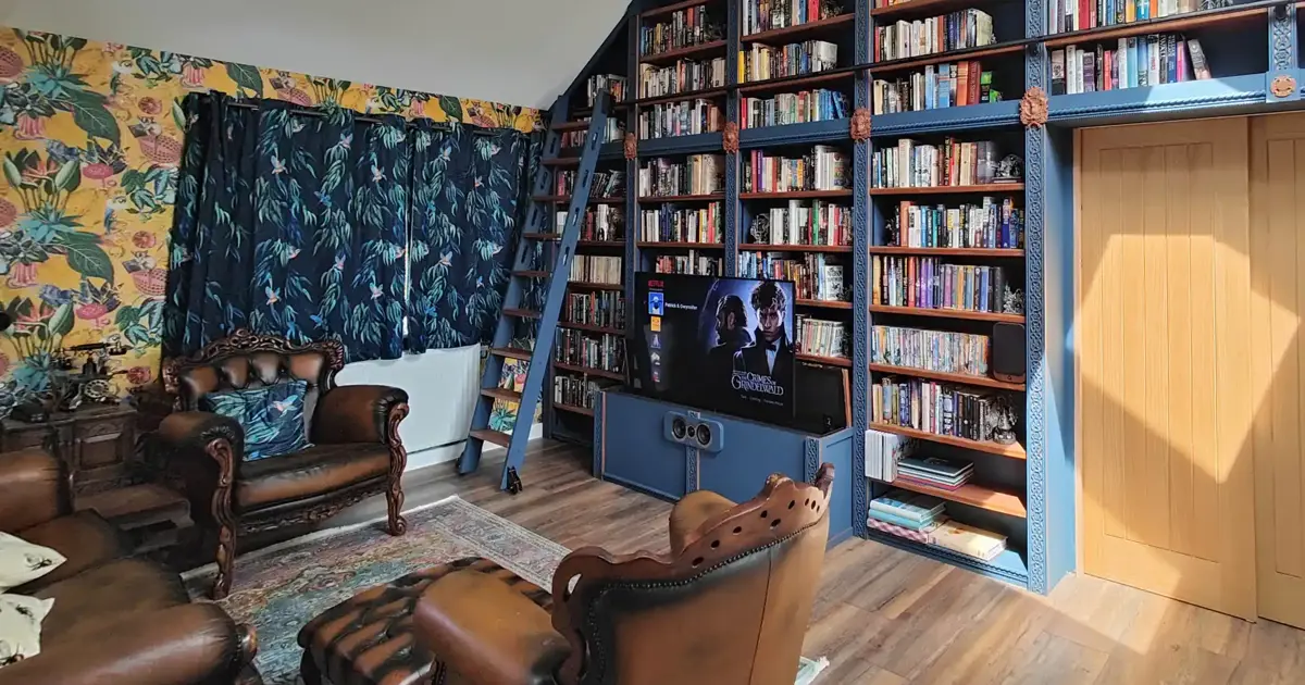 Customer Installation showcase TV lift in a bespoke library